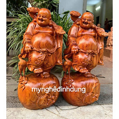 Tượng phật di lặc dắt cò bằng gỗ hương đá cao 40cm