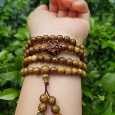 Vòng đeo tay nữ gỗ trầm mix bông hoa sen kiểu quấn tay 4 vòng may mắn tài lộc  Size hạt 6mm  Màu vàng nâu vân sáng nhẹ đeo tay rất đẹp xinh mùi thơm nhẹ nhẹ ạ